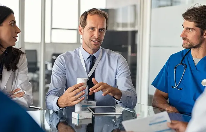 A man addresses a room of doctors